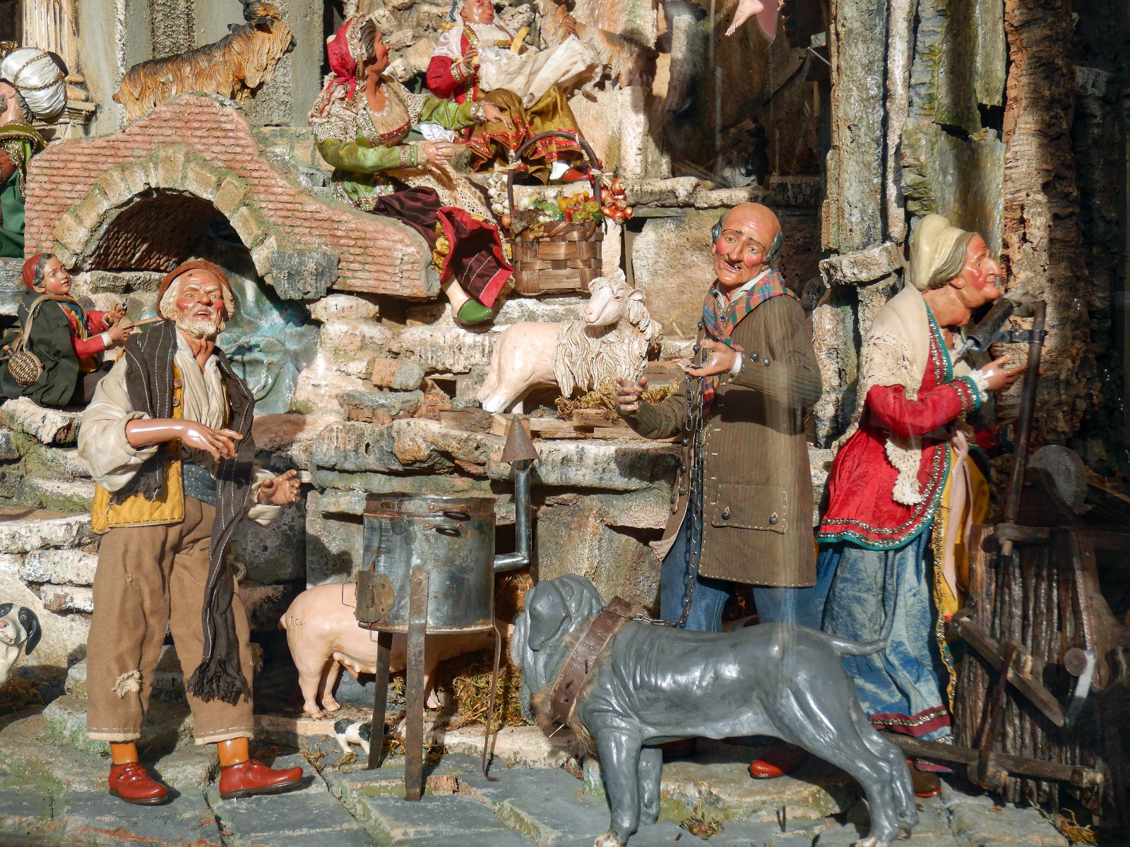 Everyday scene in a Neapolitan presepe: merchants, animals and tufa-stone houses