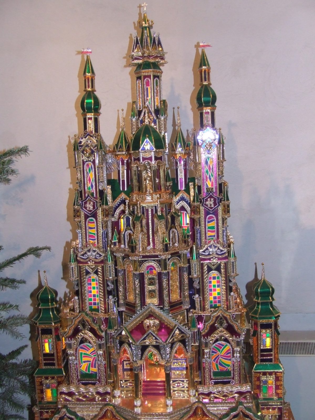 Szopka krakowska: a Polish nativity scene shaped like a miniature gilded and colorful cathedral