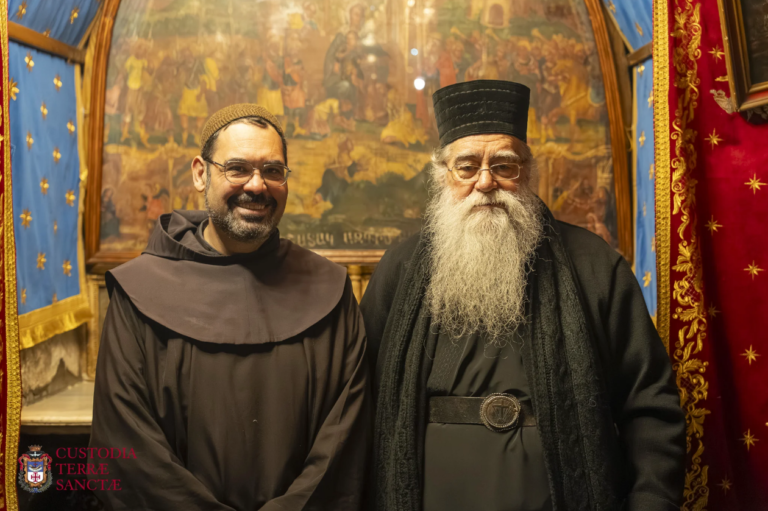 A Franciscan friar and a cleric of an Eastern Church in the Church of the Nativity.